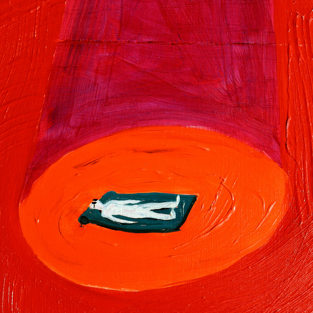 Album Cover: A painting of a man lying face-up on a mat, in what appears to be a spotlight.  The background is a deep red