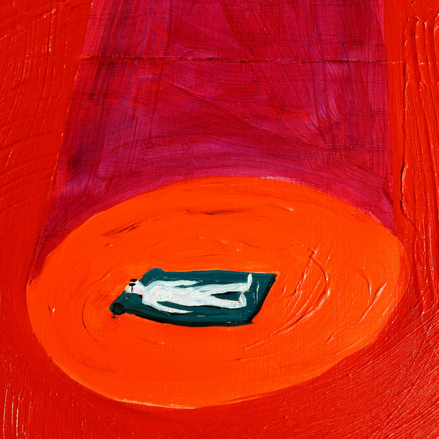 Album Cover: A painting of a man lying face-up on a mat, in what appears to be a spotlight. The background is a deep red