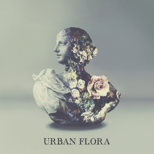 Album Cover: A Roman bust covered with flowers, on a silver background